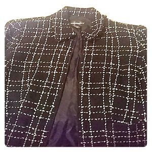 Cute black jacket with white stitching.